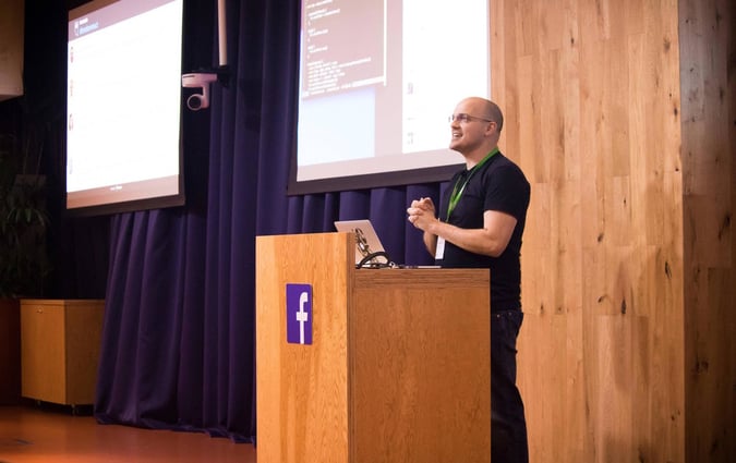 Man speaking on a podium