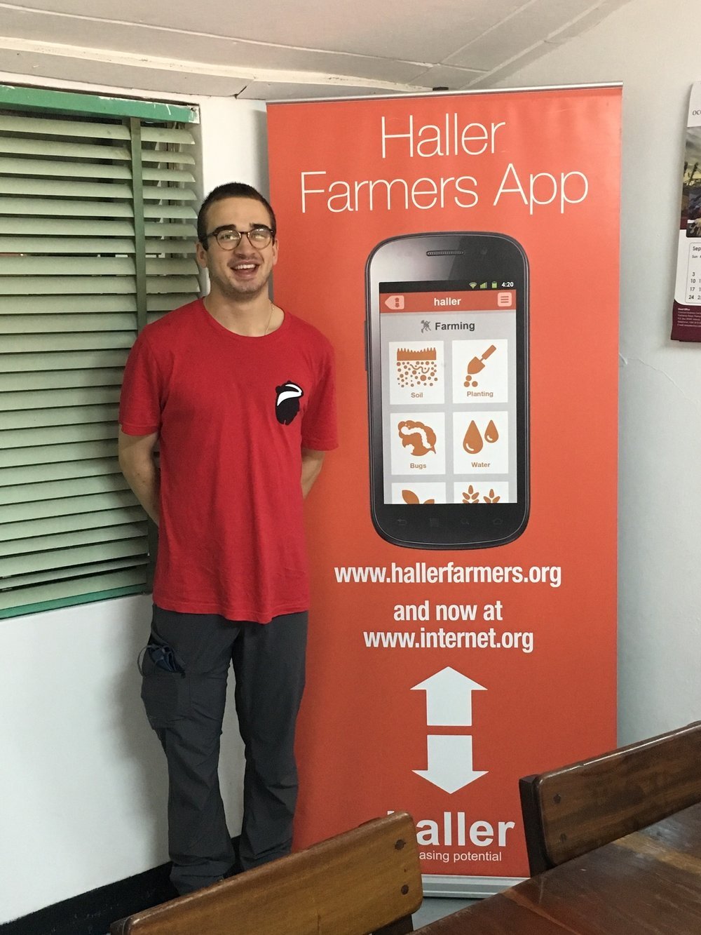  My son Hugo infront of an Haller banner 